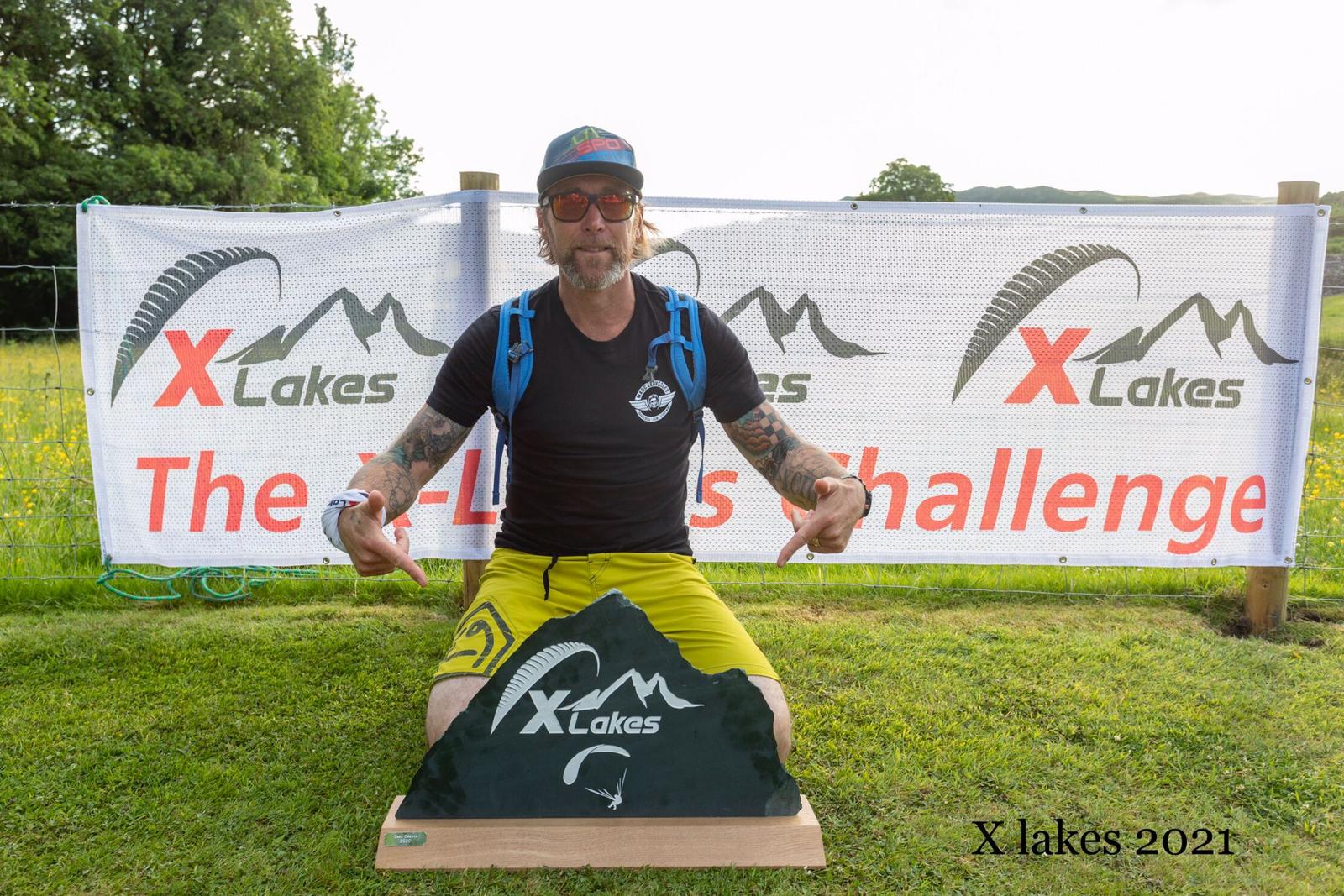 Mark picking up his trophy from X Lakes 2021 Champion