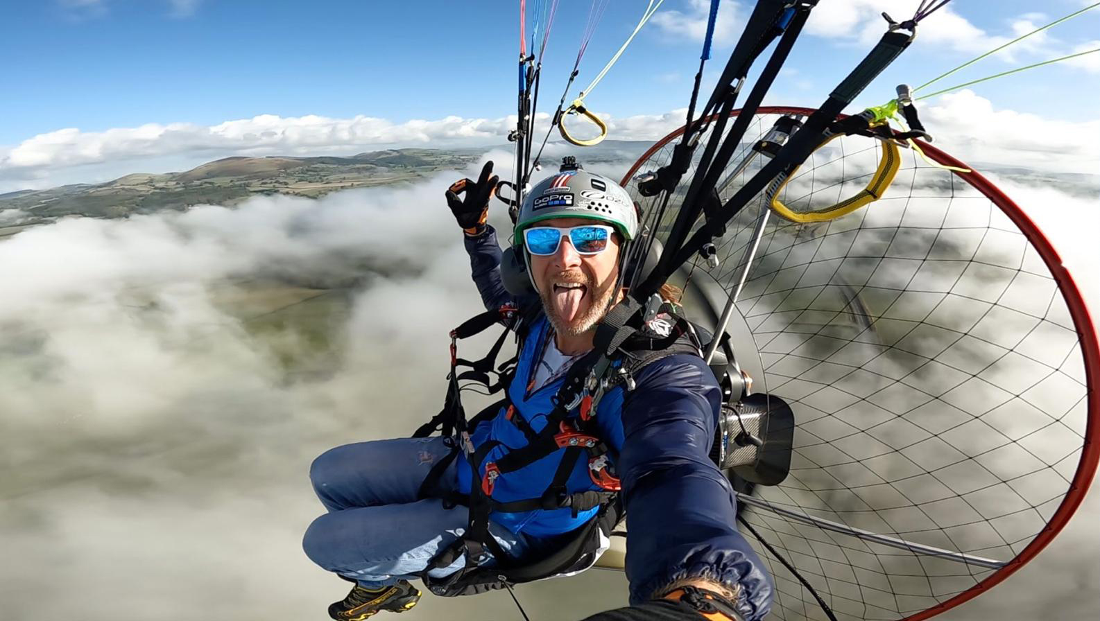 Mark flying his parajet paramotor over the Shopshire hills