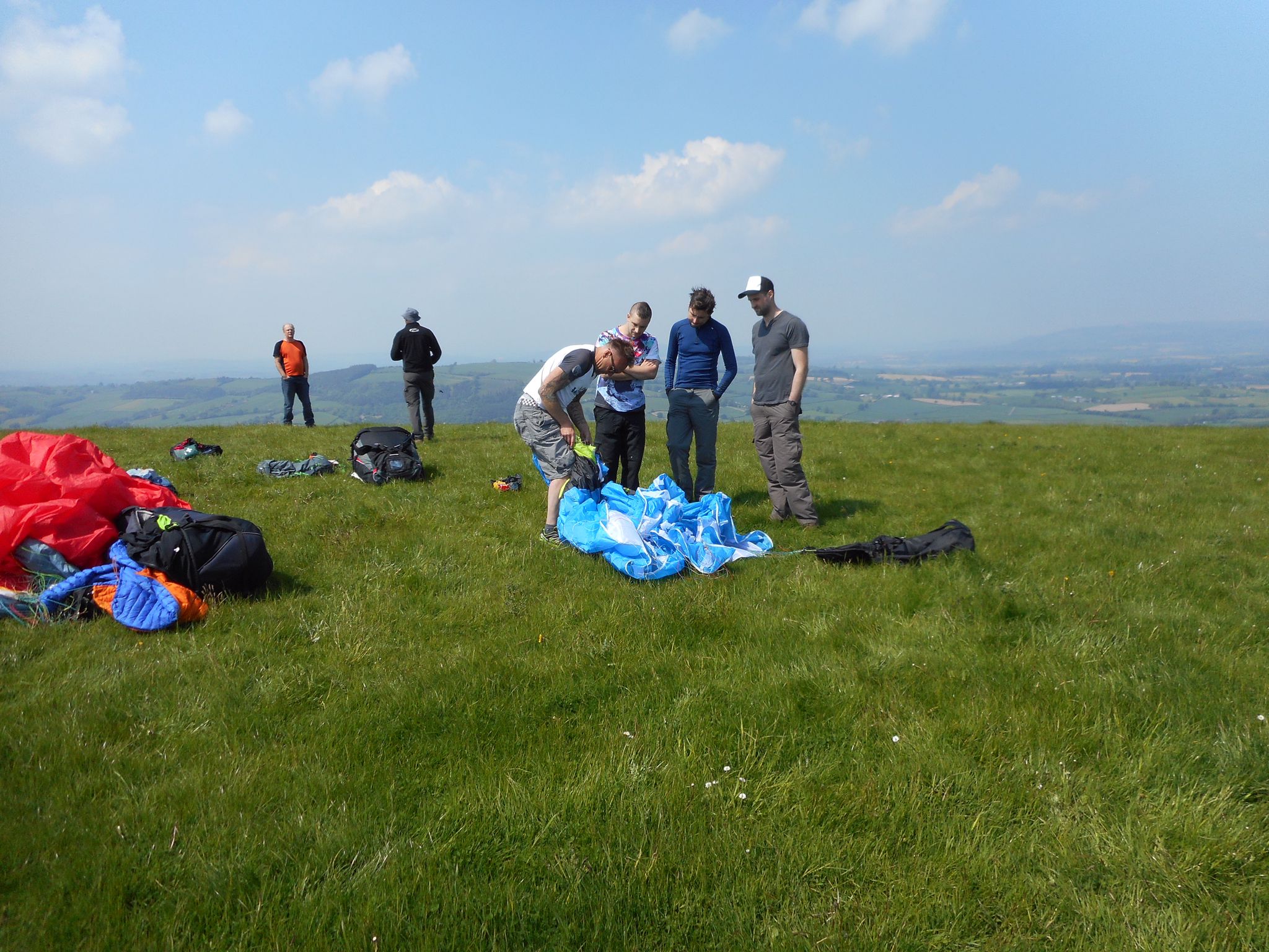 Mark teaching students how to pack a paraglider correctly